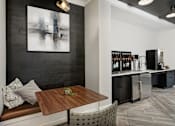 Thumbnail 6 of 34 - A modern kitchen with a wooden table and a bench.