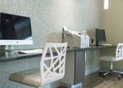 Thumbnail 6 of 35 - a desk with a computer and a chair in a hotel room