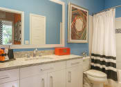 Thumbnail 23 of 35 - a bathroom with a sink and a toilet