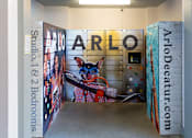 Thumbnail 41 of 57 - a corridor with a mural of a dog with glasses on the door