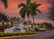 Thumbnail 2 of 43 - A sign for Ashley in front of a palm tree.