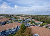 Thumbnail 40 of 43 - A view of a residential area with houses and a parking lot.