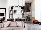 Thumbnail 8 of 71 - a living room with a couch and a tv