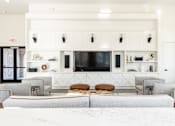 Thumbnail 45 of 71 - a living room with couches and chairs and a television
