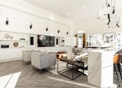 Thumbnail 44 of 71 - a living room with a kitchen and a dining room