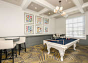 Thumbnail 9 of 36 - a games room with a pool table and chairs