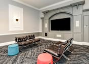 Thumbnail 10 of 36 - a large living room with leather couches and a tv