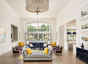 Thumbnail 2 of 36 - a living room with a couch and chairs and a large window