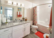 Thumbnail 21 of 36 - a bathroom with a sink toilet and a bath tub