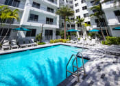Thumbnail 4 of 30 - a large swimming pool in front of an apartment building at Saba Pompano Beach, Pompano Beach, 33062