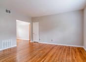 Thumbnail 9 of 18 - a bedroom with hardwood floors and grey walls at Avondale Station Apartments, Decatur