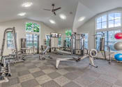 Thumbnail 12 of 20 - A spacious home gym with a variety of exercise equipment.