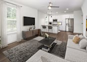 Thumbnail 19 of 50 - a living room with a couch and a coffee table