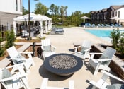 Thumbnail 42 of 70 - our apartments have an outdoor patio with chairs and a fire pit