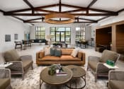 Thumbnail 20 of 70 - Belmont, NC Apartments - Banks at Mt. Holly - Clubhouse with High Ceilings, Seating Area, and Kitchen