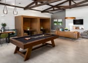 Thumbnail 22 of 70 - a living room with a pool table in the center of it