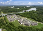 Thumbnail 66 of 70 - an aerial view of a campus with a river