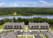 Thumbnail 65 of 70 - an aerial view of an apartment complex with a lake in the background