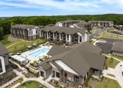 Thumbnail 59 of 70 - an aerial view of an apartment complex with a swimming pool