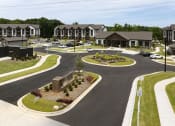 Thumbnail 62 of 70 - an aerial view of a street with houses and a parking lot