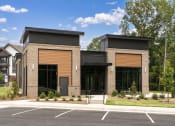 Thumbnail 52 of 70 - an image of the front of a building with a parking lot