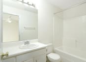 Thumbnail 18 of 36 - bathroom with white cabinets and bath tub
