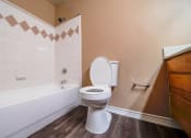 Thumbnail 33 of 69 - a bathroom with a toilet and a tub