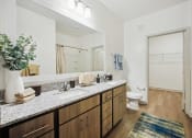 Thumbnail 9 of 24 - a bathroom with a sink and a mirror