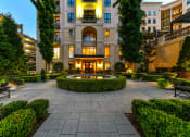 Thumbnail 57 of 58 - a courtyard with a fountain in front of a building