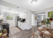 Thumbnail 14 of 35 - an open kitchen and living room with a dining table