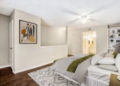 Thumbnail 4 of 13 - a bedroom with a bed and a ceiling fan