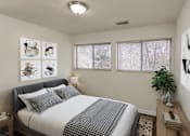 Thumbnail 4 of 30 - A bedroom with a bed, nightstand, and pictures on the wall.