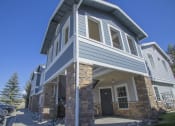 Thumbnail 7 of 43 - a view of the front of a house with a blue sky background
