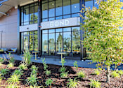 Thumbnail 21 of 27 - a building with large glass windows and a sign that says bond