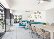 Thumbnail 9 of 29 - A patio with a table and chairs is shown.