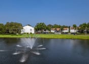 Thumbnail 31 of 34 - a fountain in the middle of a pond at L'Estancia, Sarasota, FL