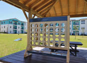 Thumbnail 20 of 24 - two blue chairs and a table in front of a gazebo