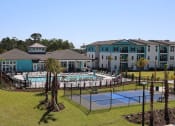 Thumbnail 19 of 24 - an aerial view of our apartments with a pool and tennis court