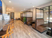 Thumbnail 27 of 46 - a seating area in a restaurant with chairs and tables