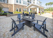 Thumbnail 31 of 41 - A patio with a table and chairs.