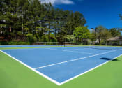 Thumbnail 24 of 27 - a tennis court with trees in the background  at Thornblade, Greenville, SC, 29615