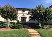Thumbnail 15 of 18 - a large white house with trees in front of it at Avondale Station Apartments, Georgia