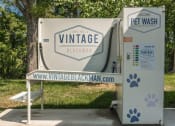 Thumbnail 30 of 37 - a tent with a sign that says vitrage wash and a bench