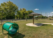 Thumbnail 31 of 37 - a playground with a swing set and a picnic shelter