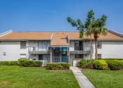 Thumbnail 2 of 34 - a white house with a palm tree in front of it at L'Estancia, Florida, 34231