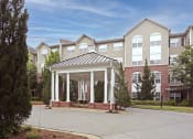 Thumbnail 3 of 30 - an image of a building with a covered porch