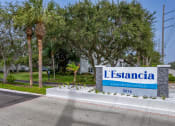 Thumbnail 26 of 34 - the sign at the entrance to the leasing office apartments at L'Estancia, Sarasota, 34231