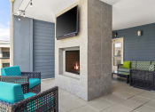 Thumbnail 38 of 49 - a living room with furniture and a fireplace