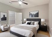 Thumbnail 44 of 53 - a bedroom with a bed and a ceiling fan
