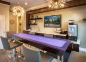 Thumbnail 8 of 49 - a dining room with a purple table and chairs